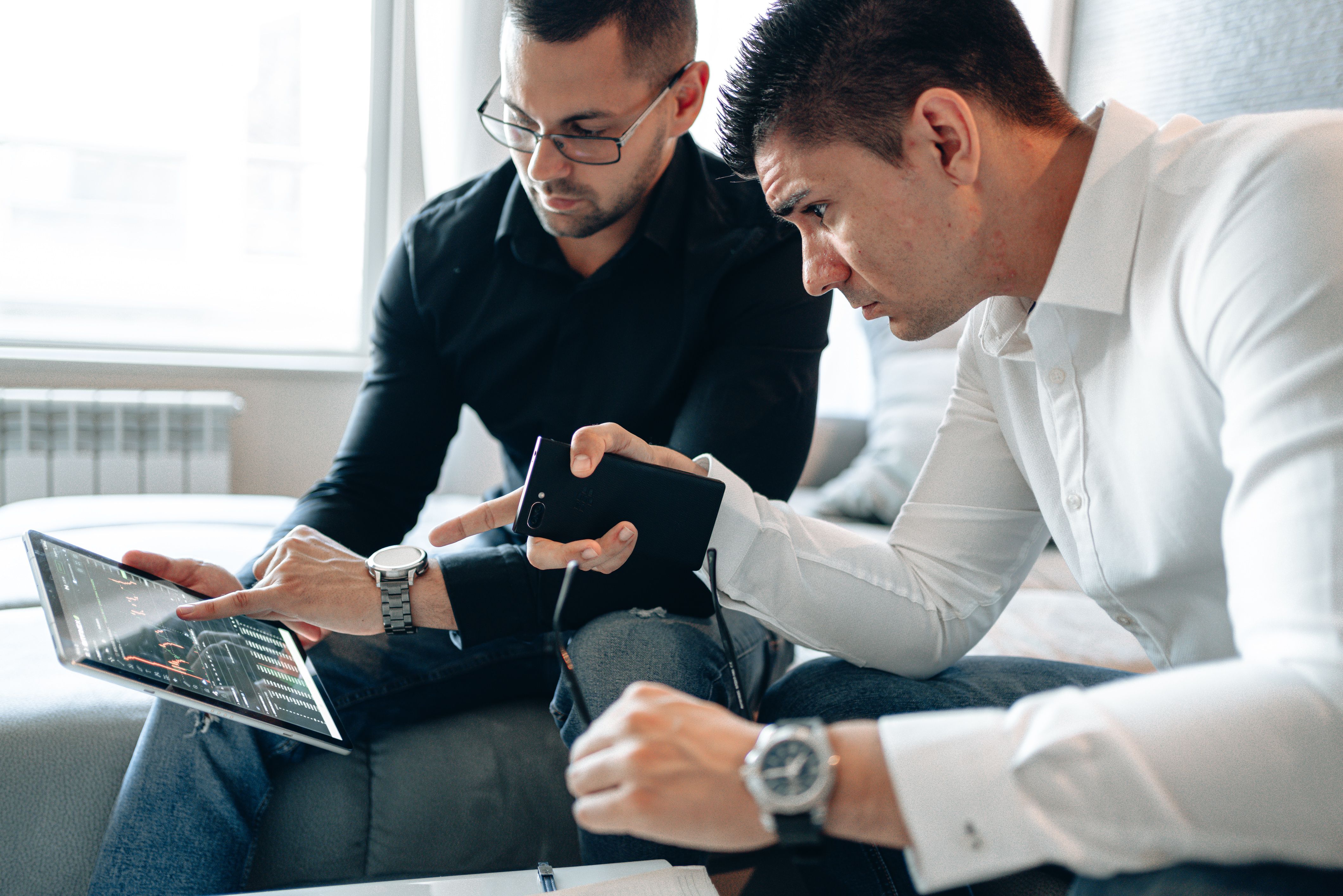 Marketing team planning connected campaign channels around a whiteboard